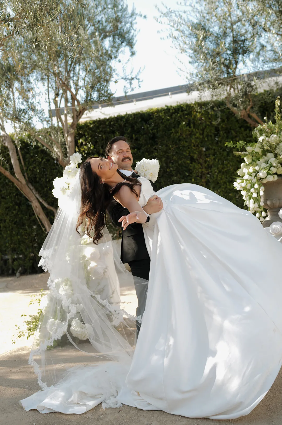 Bride and groom spin for a photo.