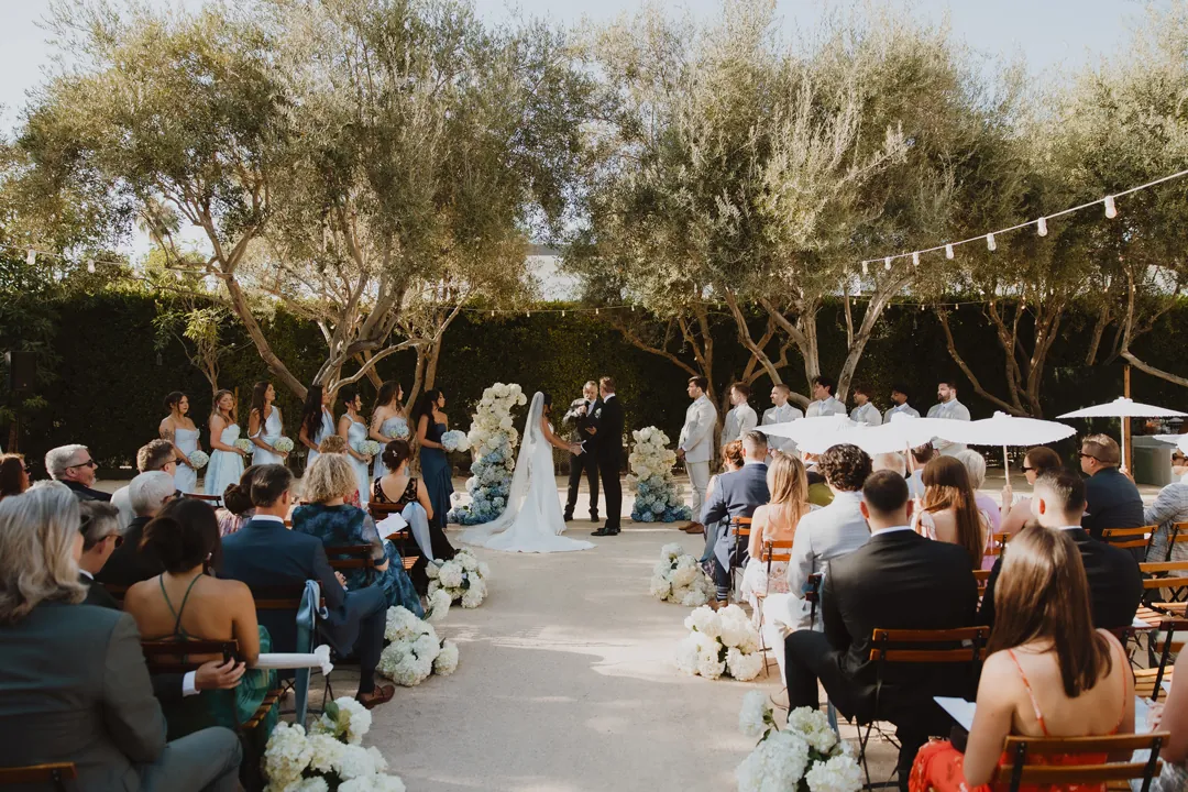 Wedding guests facing the altar in the Olive Grove.