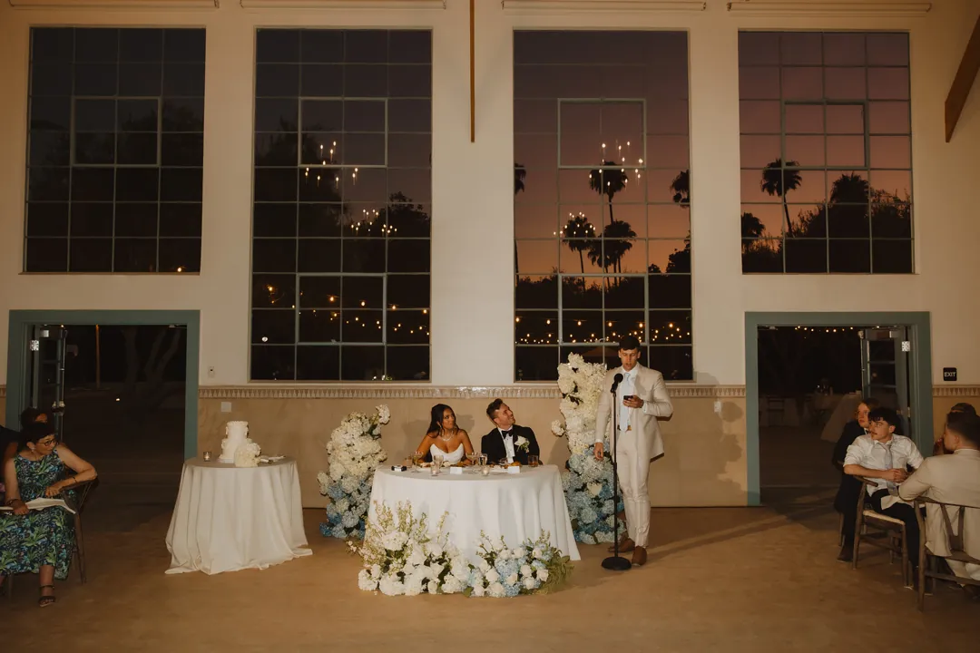 Wedding guests seated beside the sweetheart table