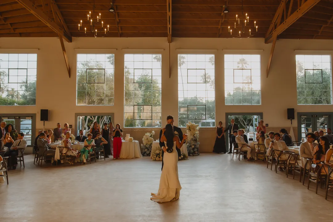 Bride and groom dancing in the reception hall