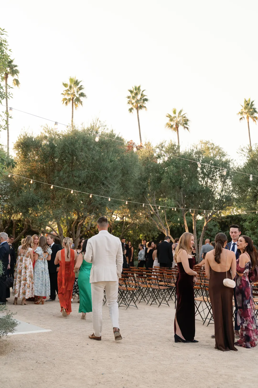 Guests mingling in the courtyard after the ceremony