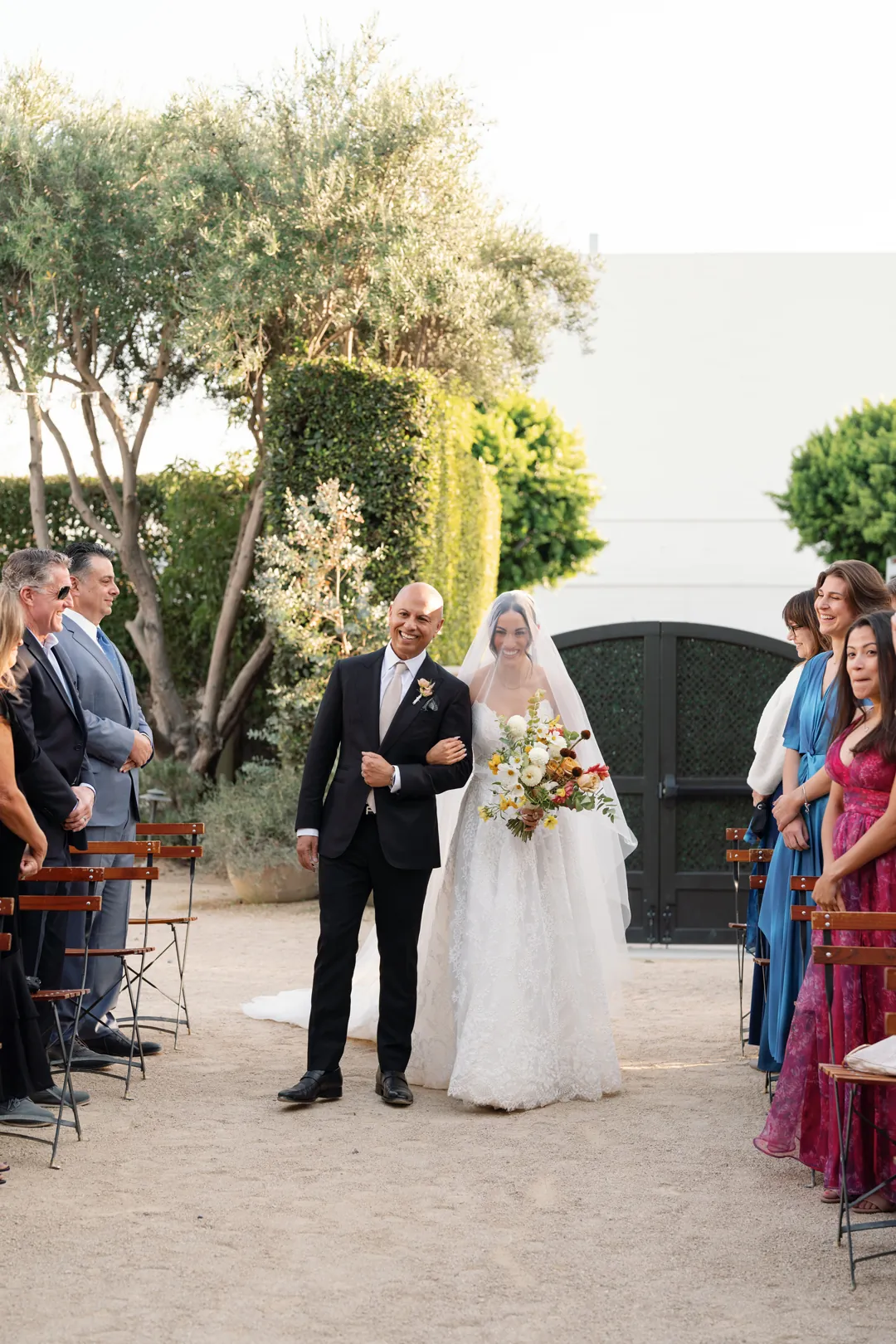 Bride entering the ceremony with an escort