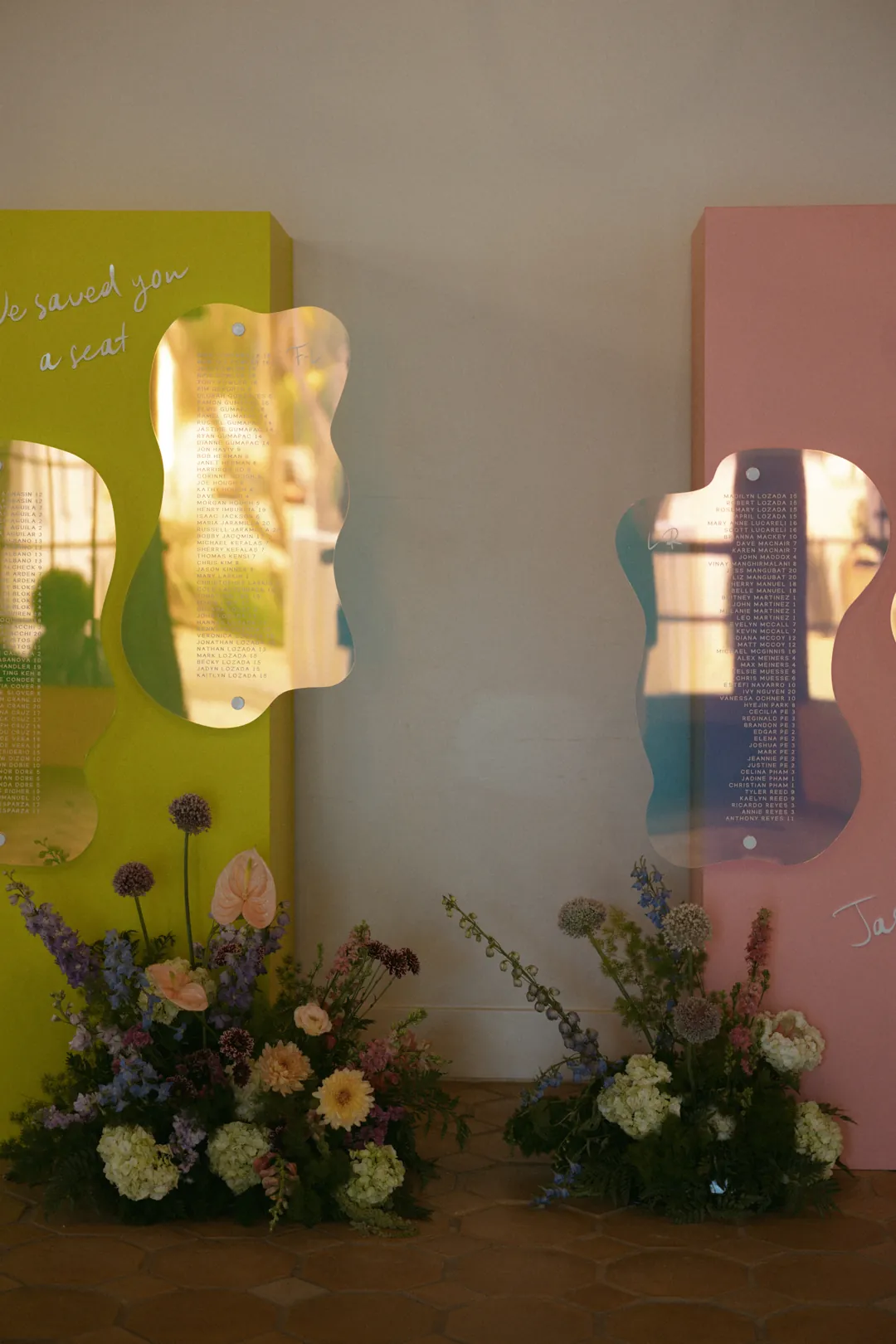 Colorful display panels with mirrors and flowers