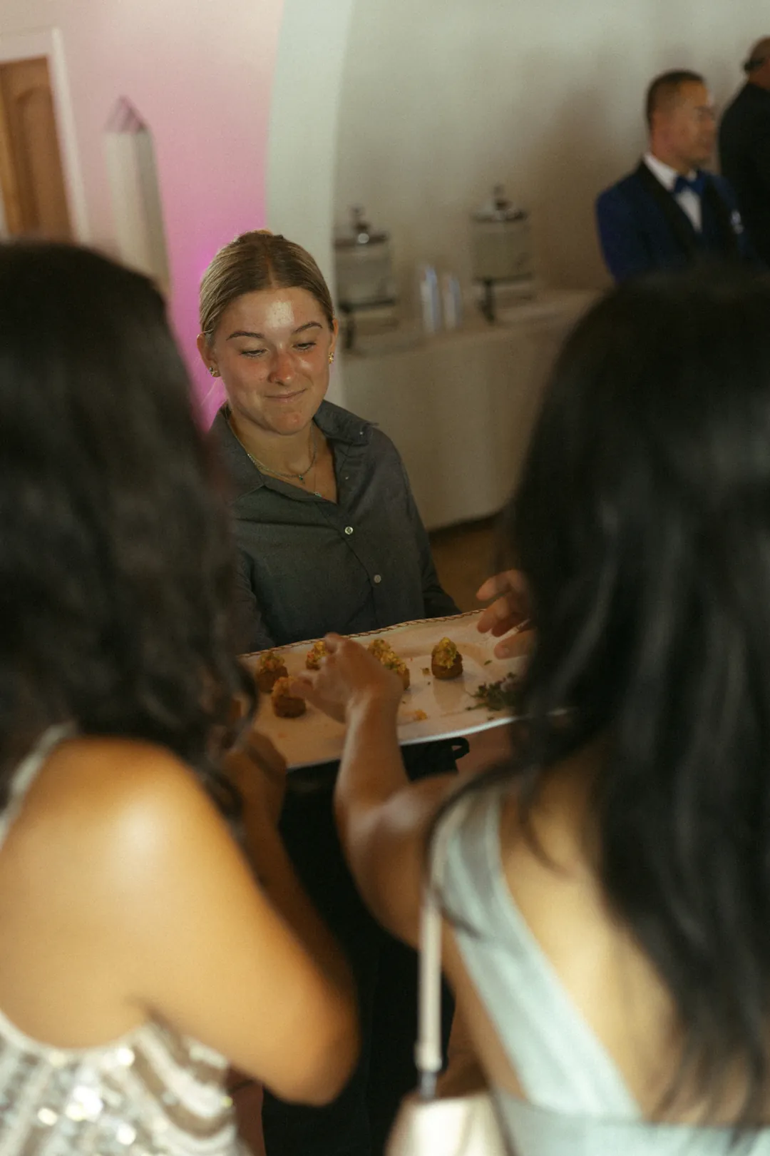 Guests gathered around a table indoors