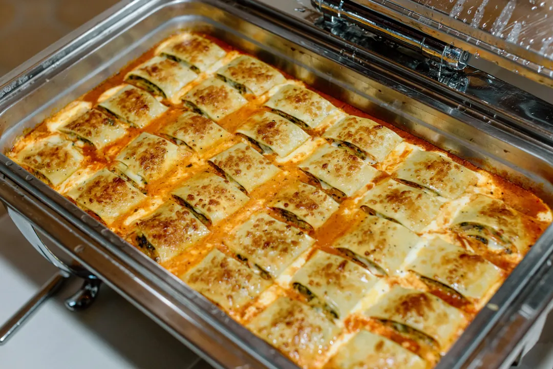 Tray of baked savory portions at the buffet
