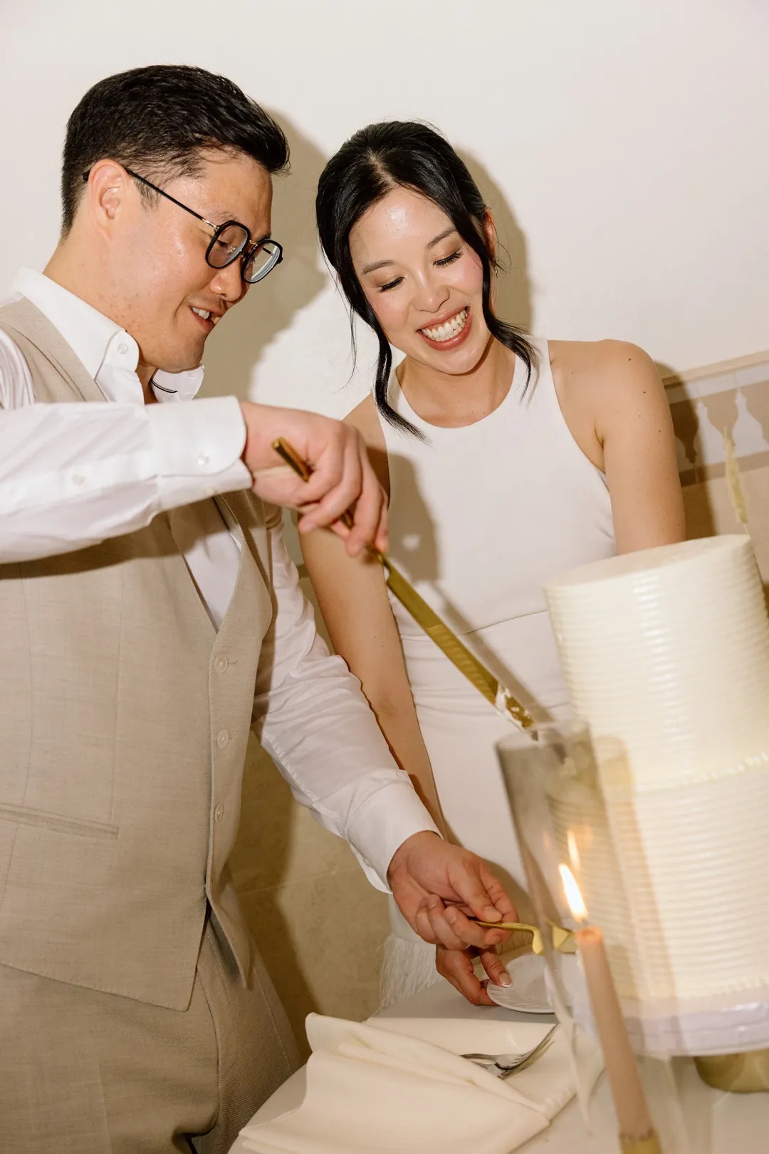 Bride and groom cutting their wedding cake