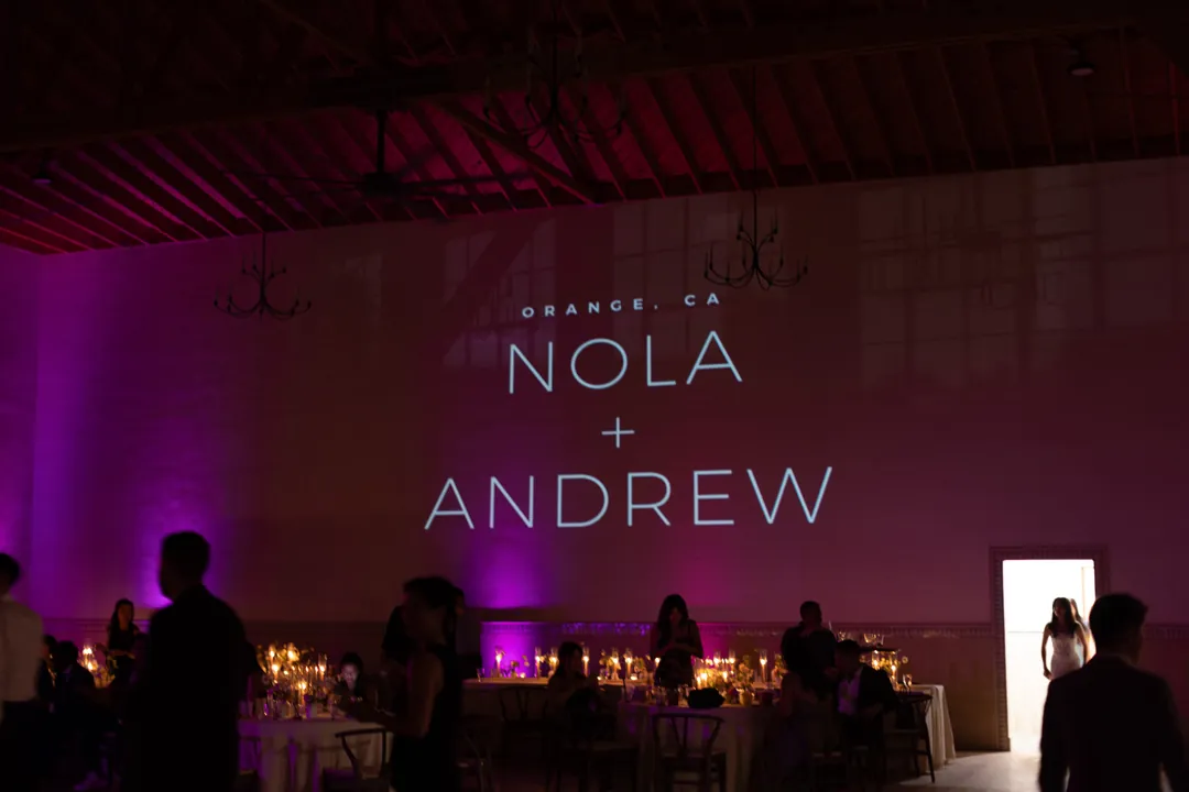 Colored reception lighting and projected couple lettering