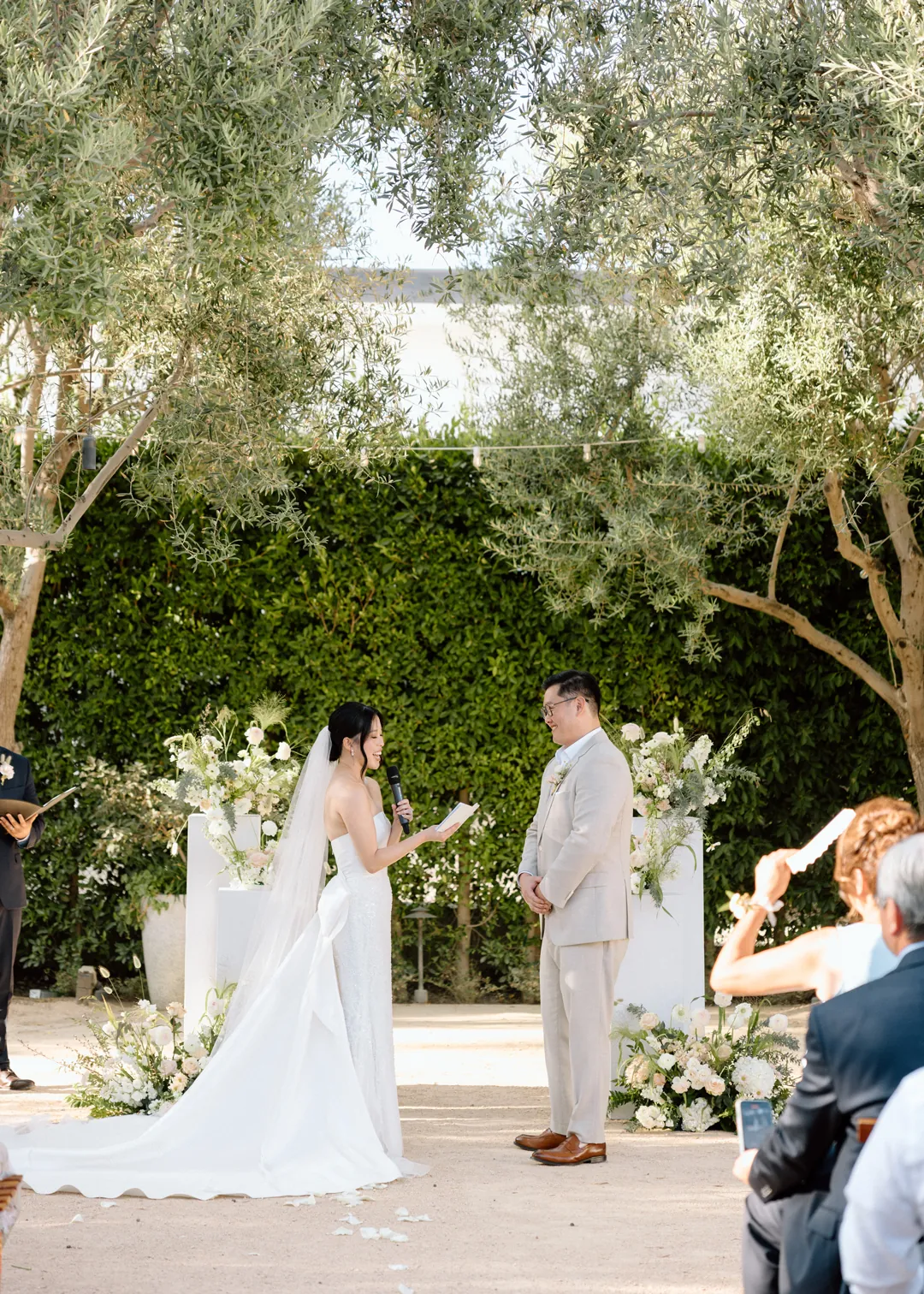 Bride and groom facing each other at the ceremony