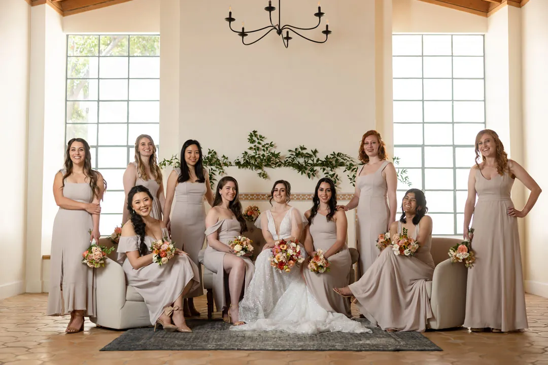 Bride and bridesmaids posing in the bright lounge
