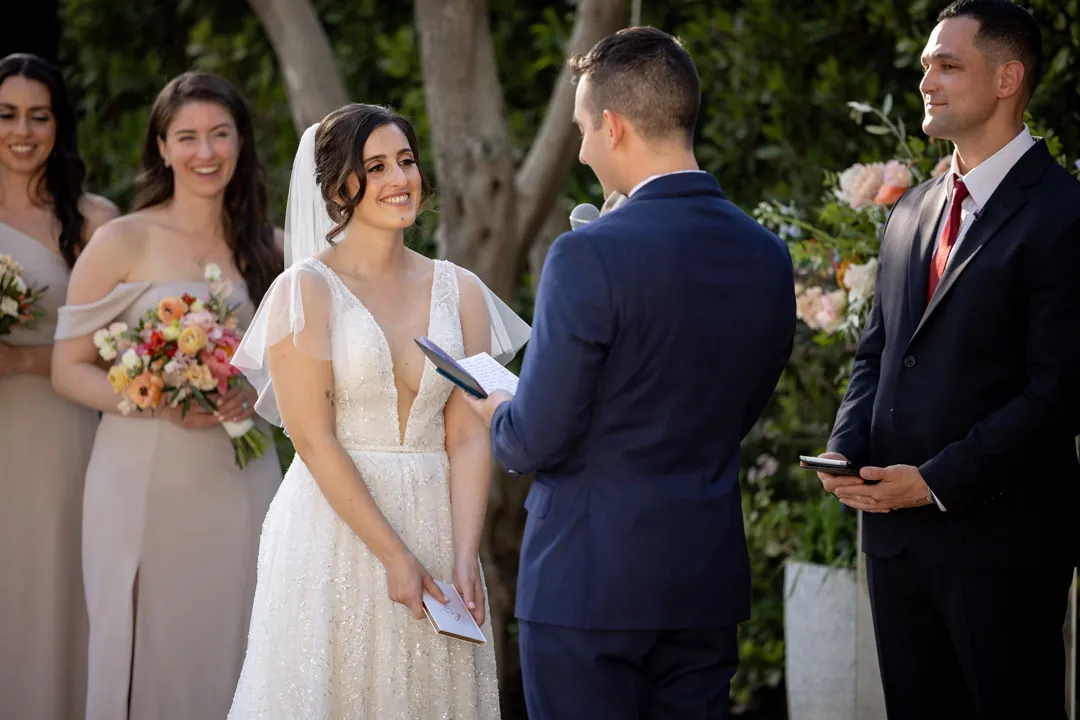 Groom reading vows to the bride