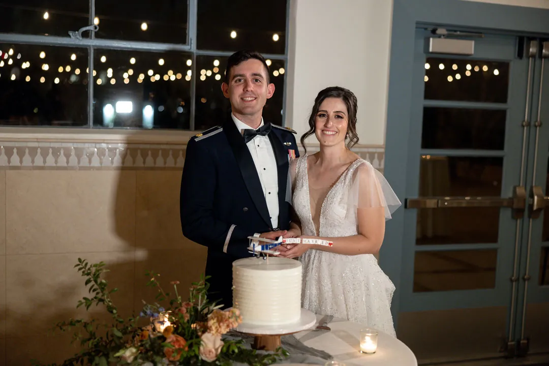 Bride and groom cutting their wedding cake