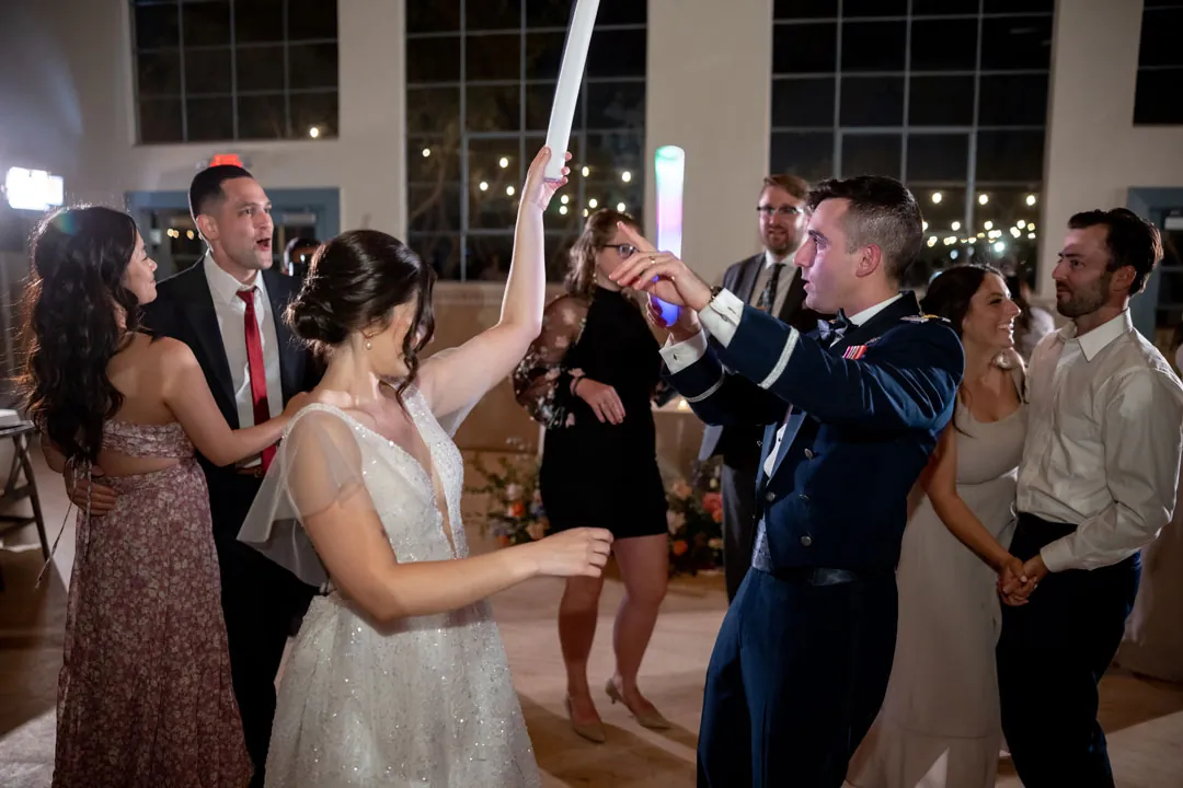 Guests dancing around the bride and groom