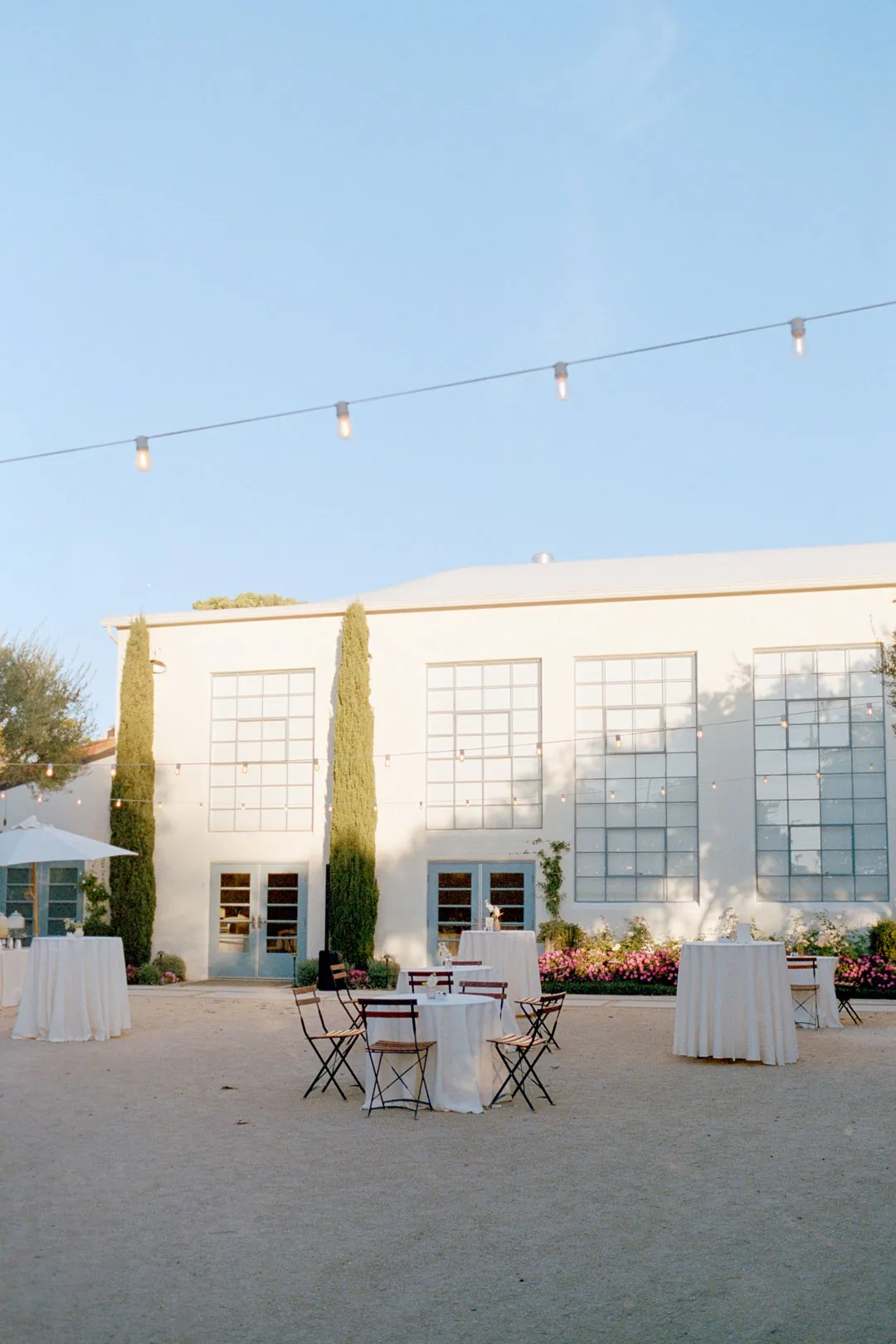 Courtyard cocktail tables outside the reception hall