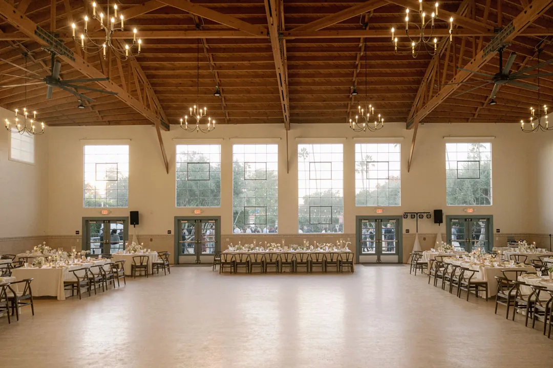 Reception hall with open floor space and dining tables