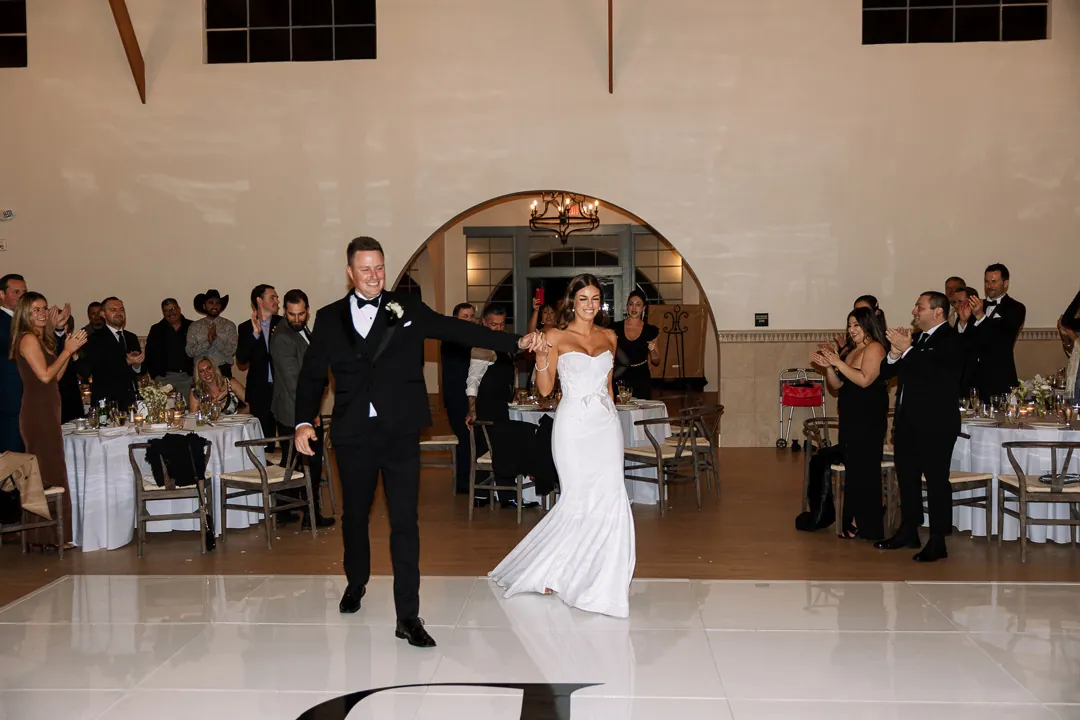 Bride and groom making their reception entrance together