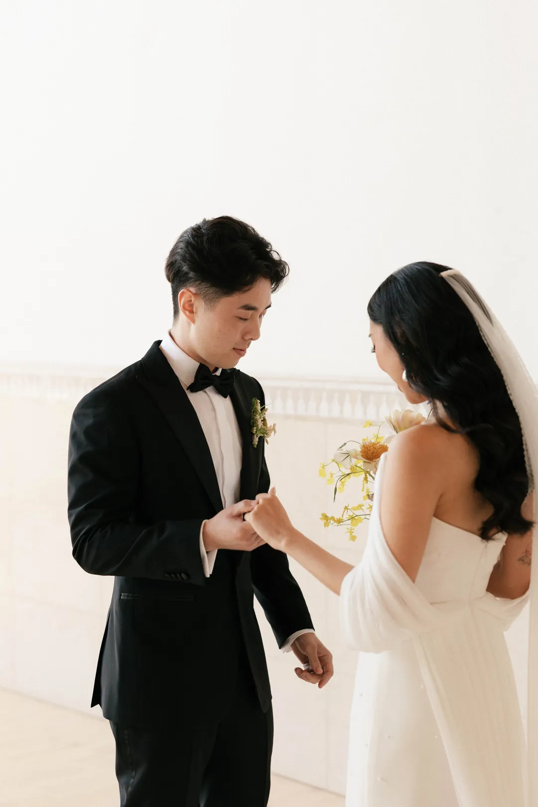 Bride and groom reading private vows together