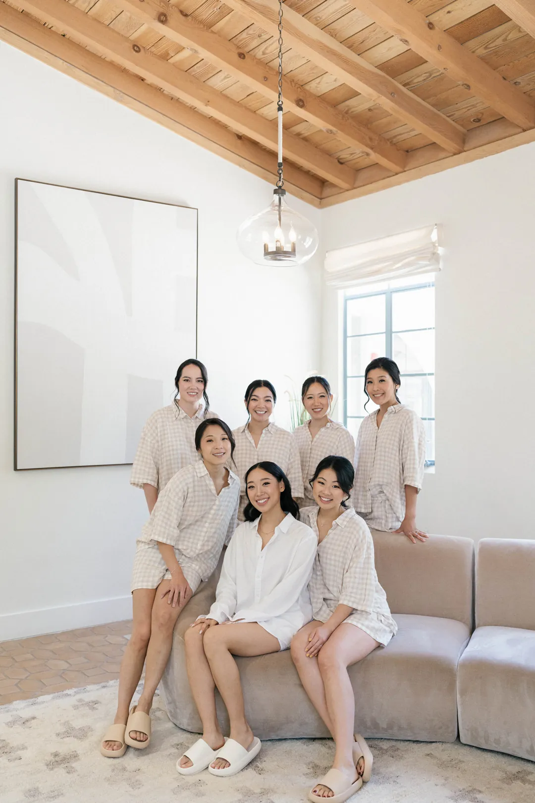 Bride and bridesmaids seated in the getting-ready lounge