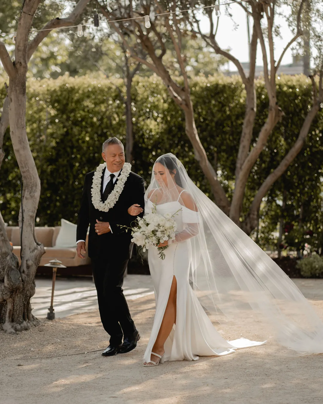 Bride approaching the ceremony with an escort