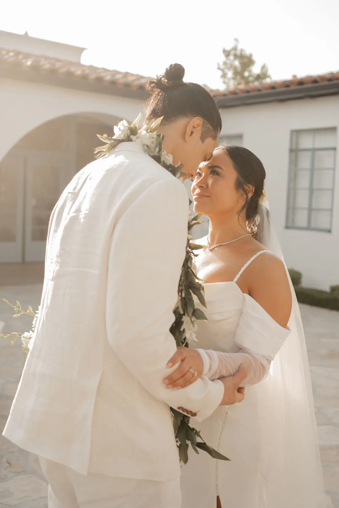 Bride and groom sharing a kiss outdoors