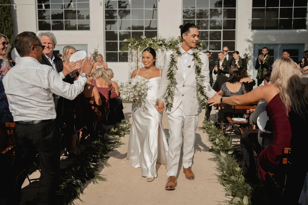 Bride and groom walking back down the aisle