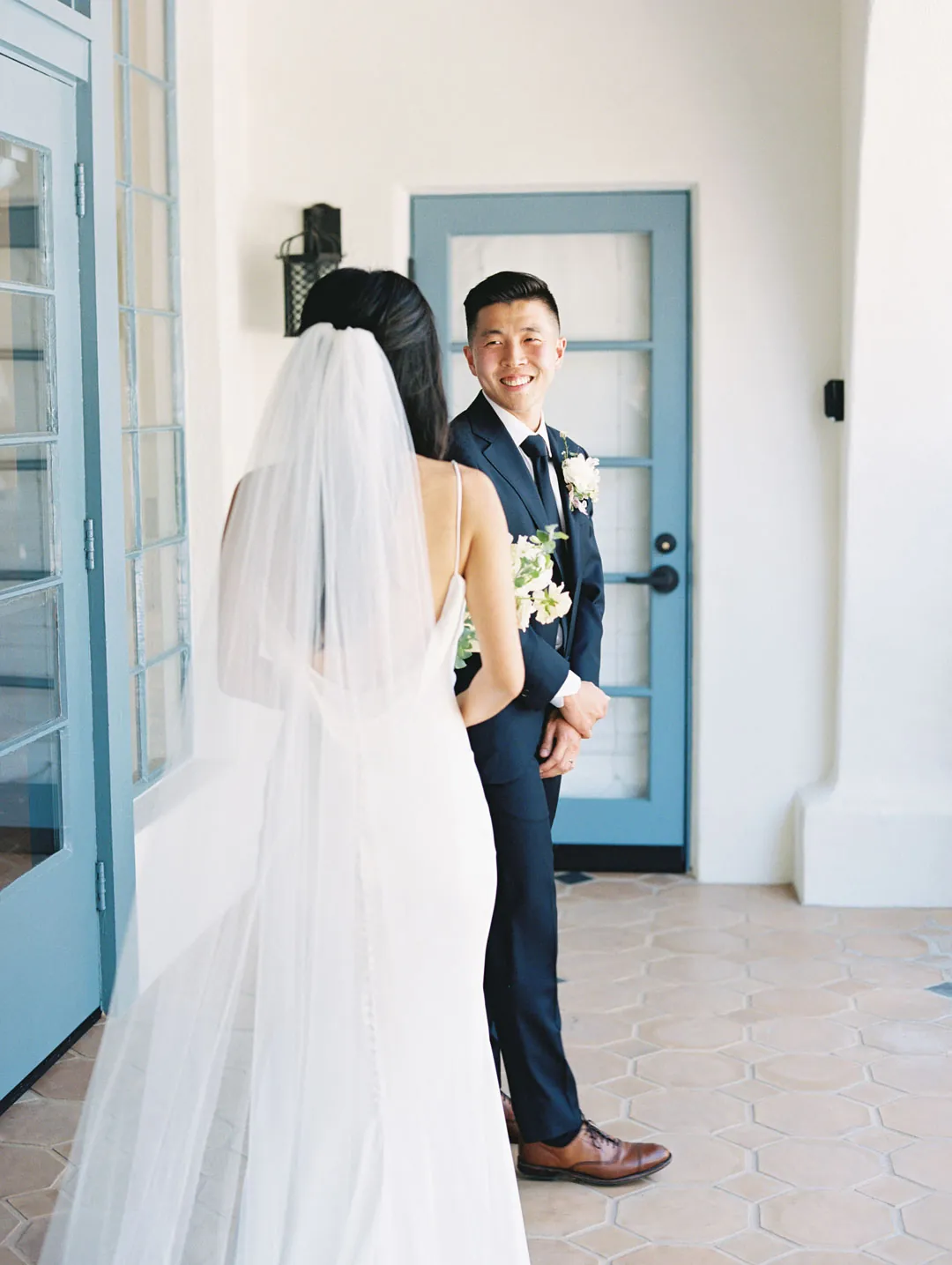 Bride approaching the groom during their first look