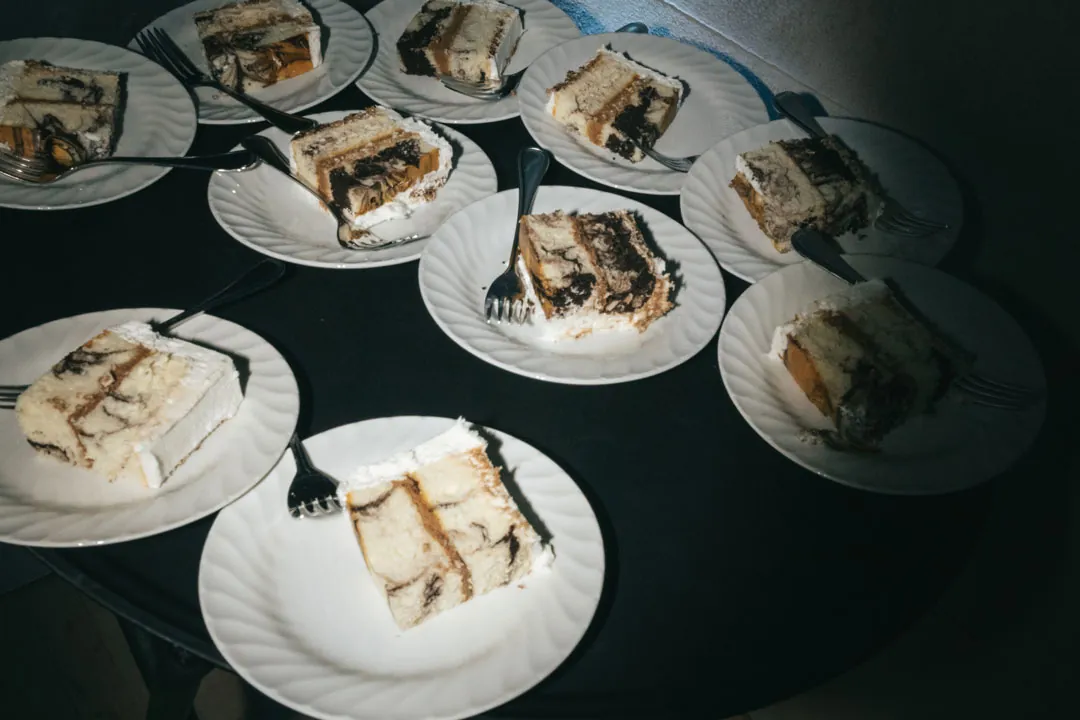 Slices of wedding cake plated for guests.