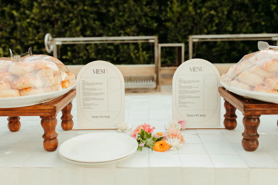 Raised platters and printed menus at the buffet
