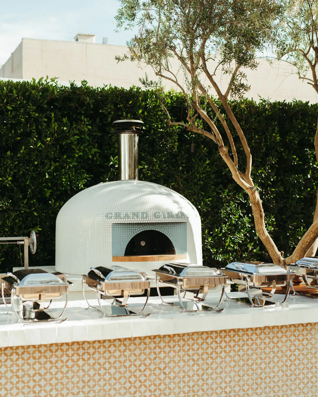 Outdoor pizza oven behind the serving counter