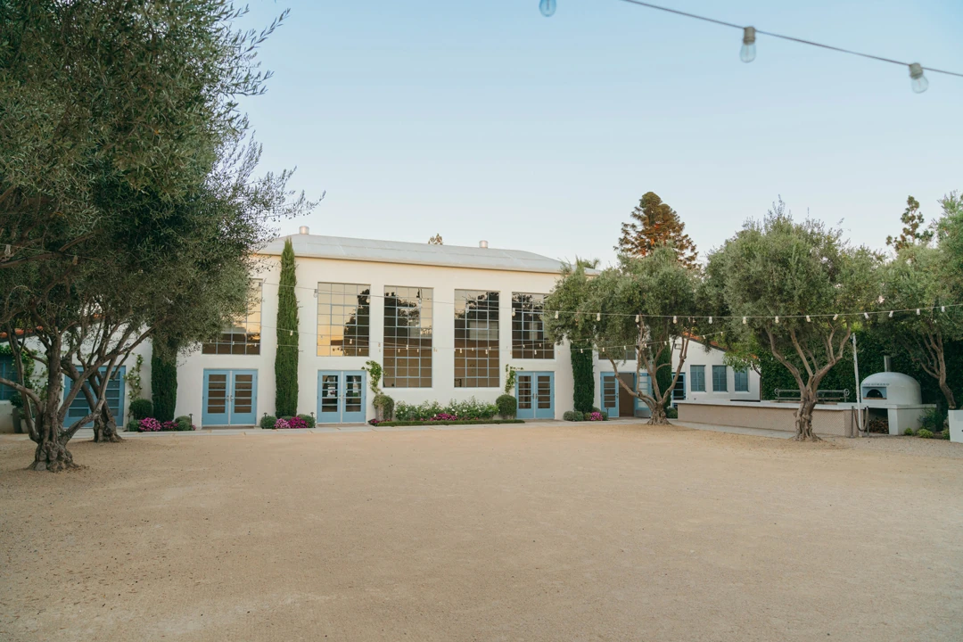 Courtyard in front of the reception hall’s tall windows.