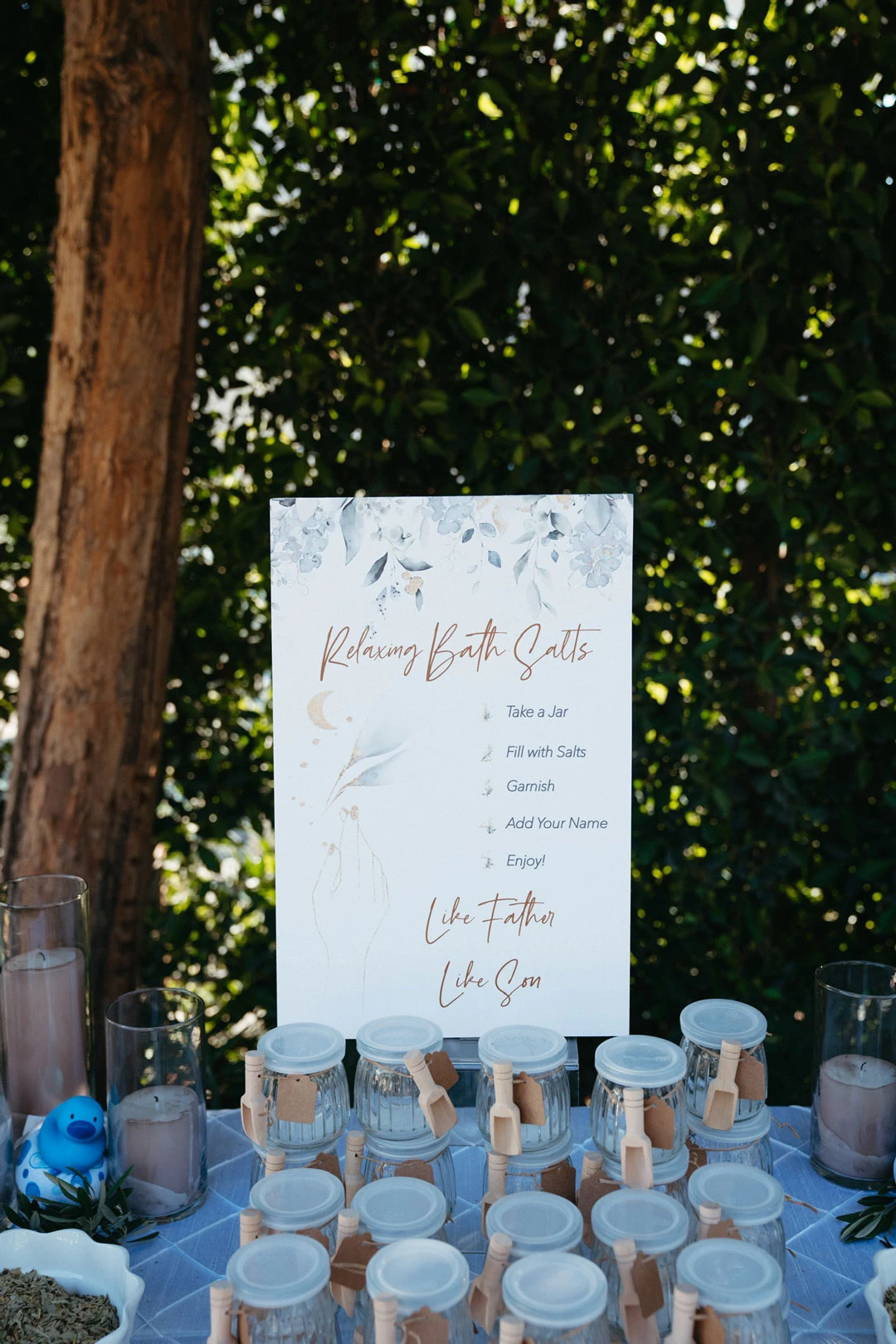 Drink menu displayed beside cups on an outdoor table.