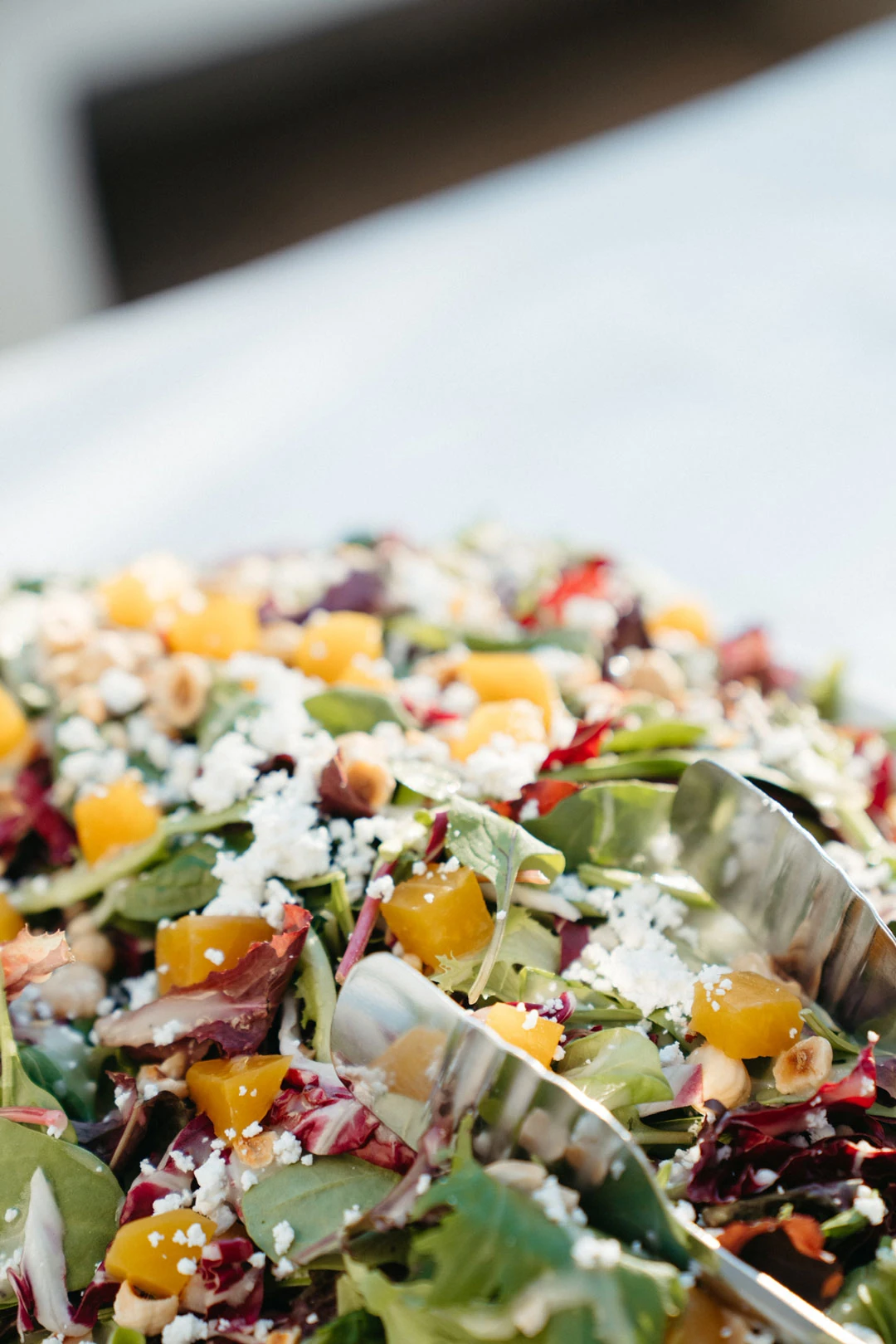 Colorful salad arranged on a white serving platter.