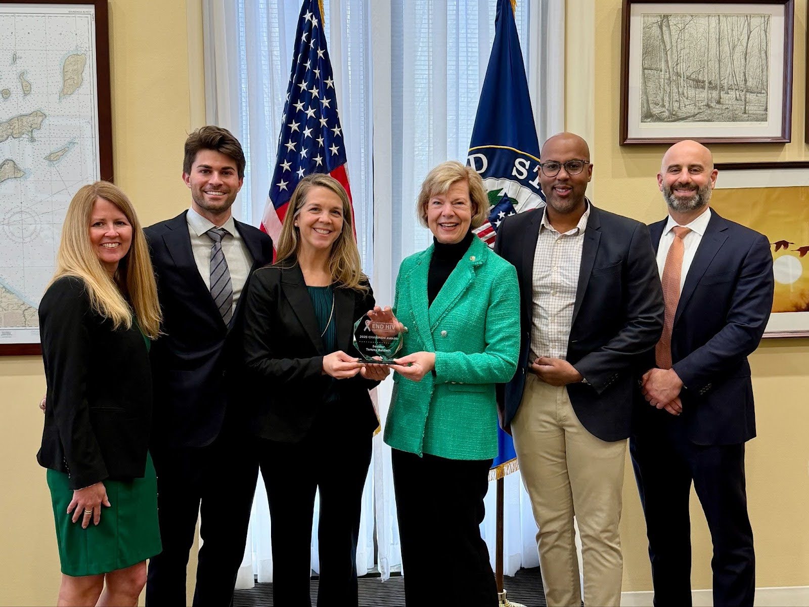 The Coalition presents Sen. Tammy Baldwin with the Inaugural Champion Awards.