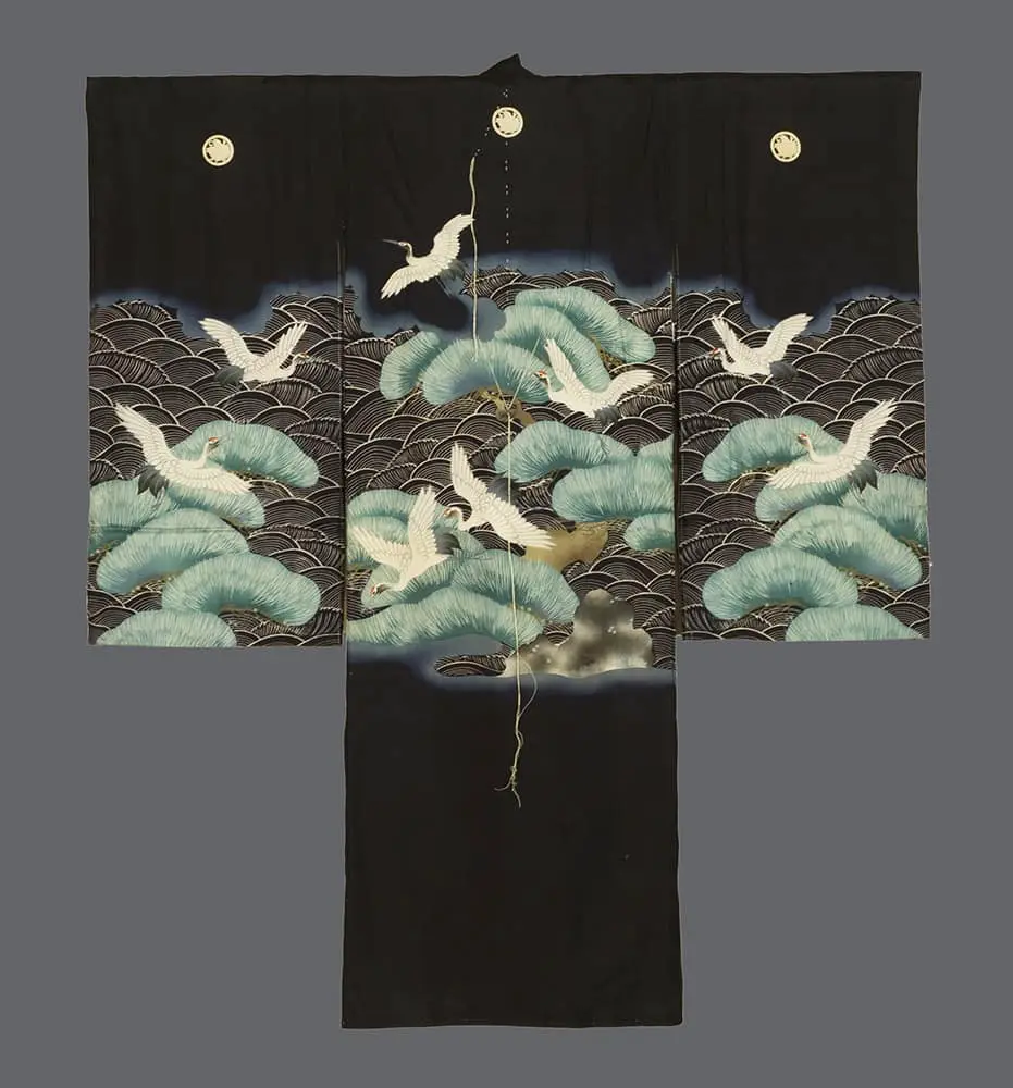 Museum-Quality Japanese Wall Art: Antique 1930s Black Silk Miyamairi Boy's Kimono. Graphic Silkscreened White Cranes and Green Pine with Golden Family Crests; Shinto Ceremonial Statement Textile for Luxury Gallery Decor.
