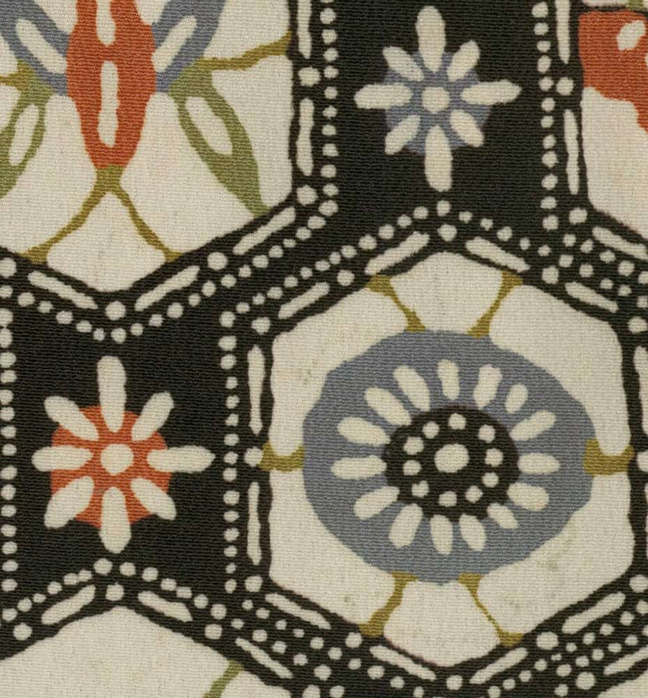 Hexagonal floral pattern fabric with black, white, orange, and blue colors