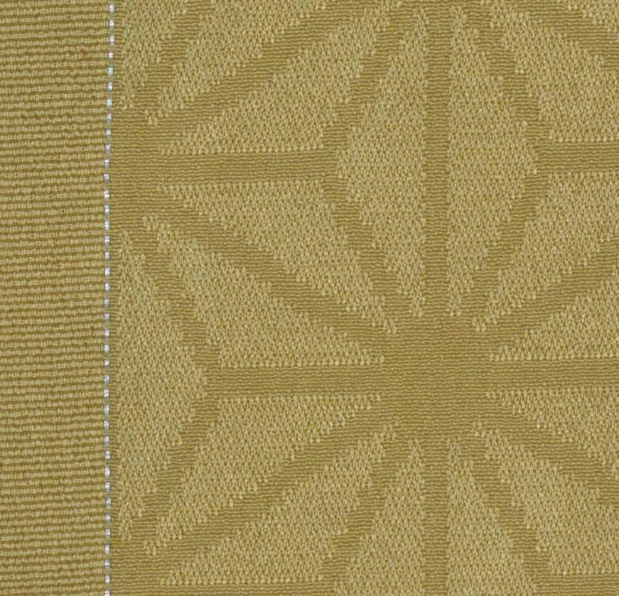 Golden textured fabric with geometric patterns and vertical stitched line