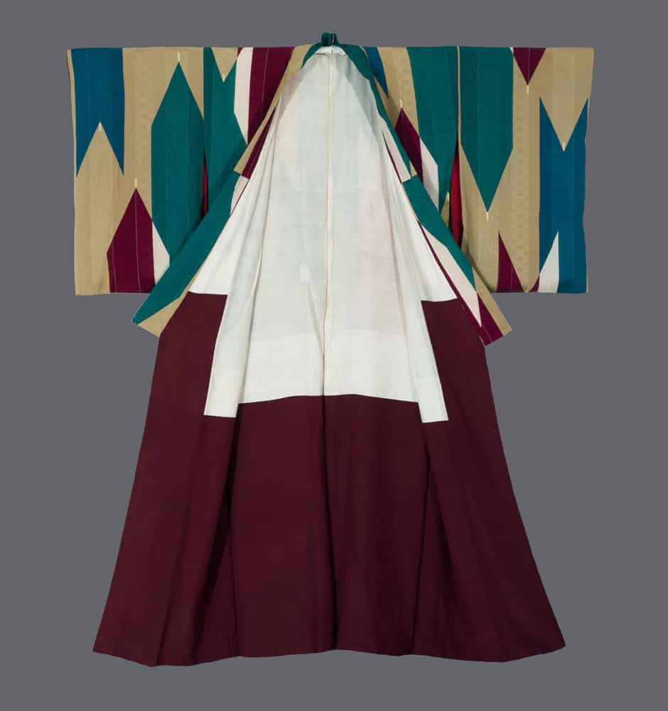 Traditional Korean hanbok in white, burgundy, and geometric teal patterns