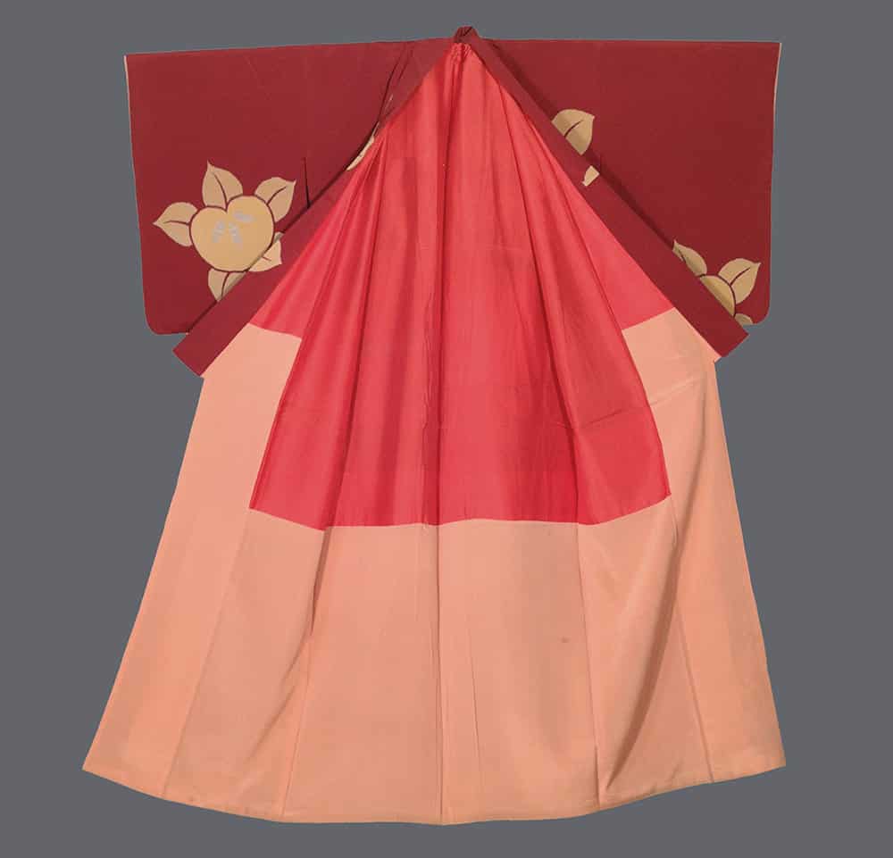 Traditional Japanese red and pink kimono with floral design on shoulders