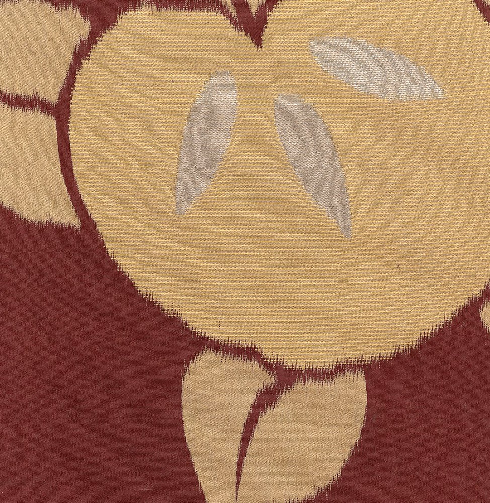 Abstract textile with burgundy and beige geometric shapes and textures
