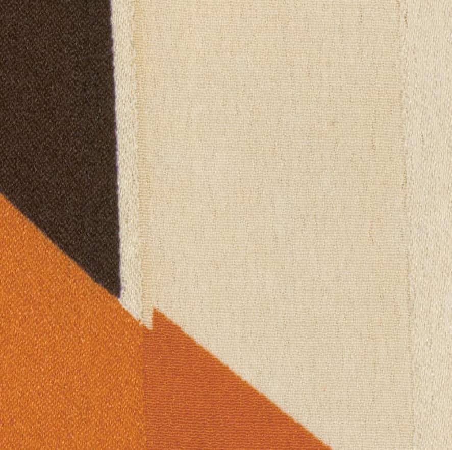 Geometric fabric with brown, orange, and cream color blocks