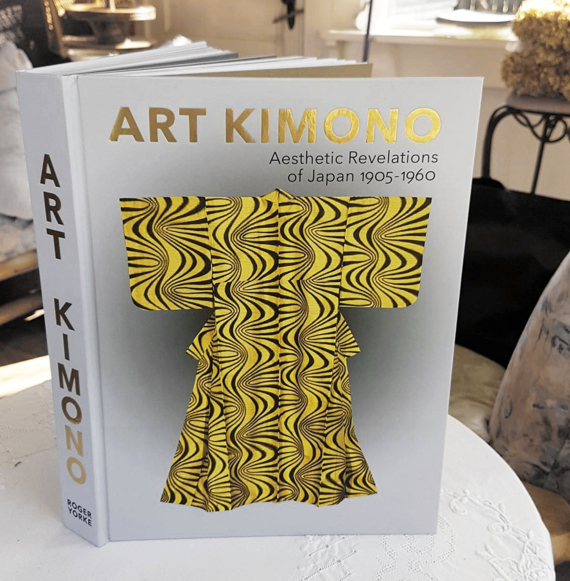 Art Kimono book with yellow and black wavy patterned kimono graphic