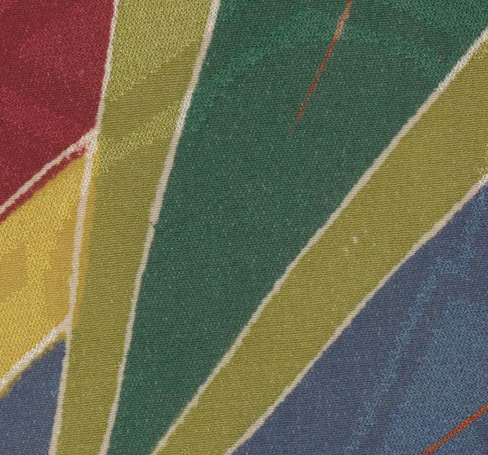 Textured fabric with diagonal stripes in red, green, yellow, and blue