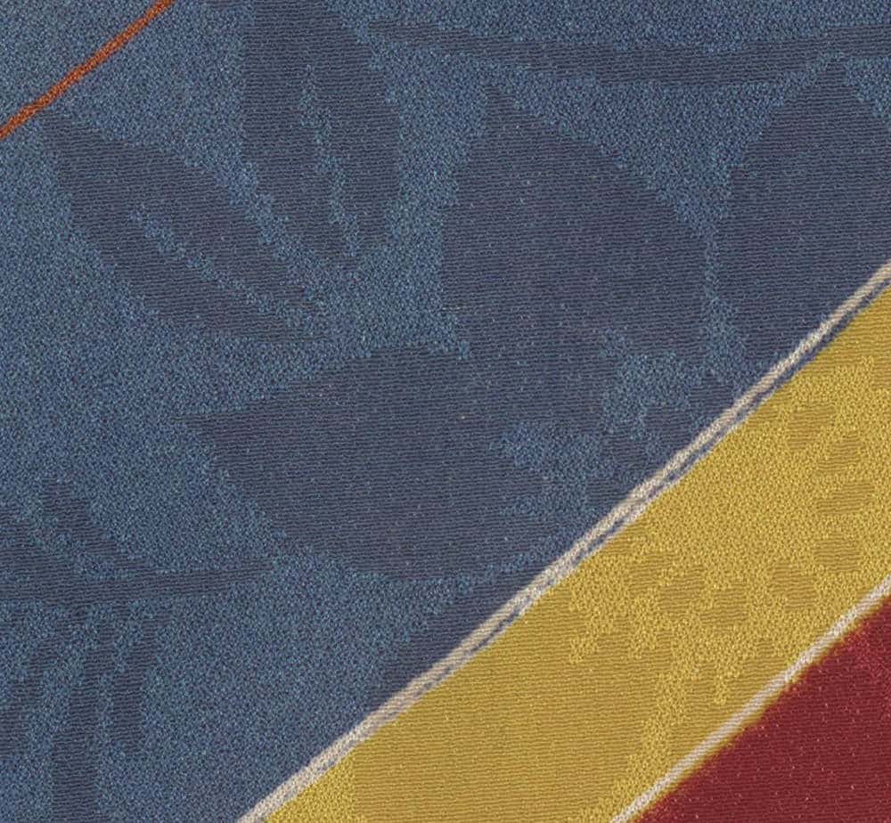 Textured fabric with diagonal lines in blue, yellow, and red colors