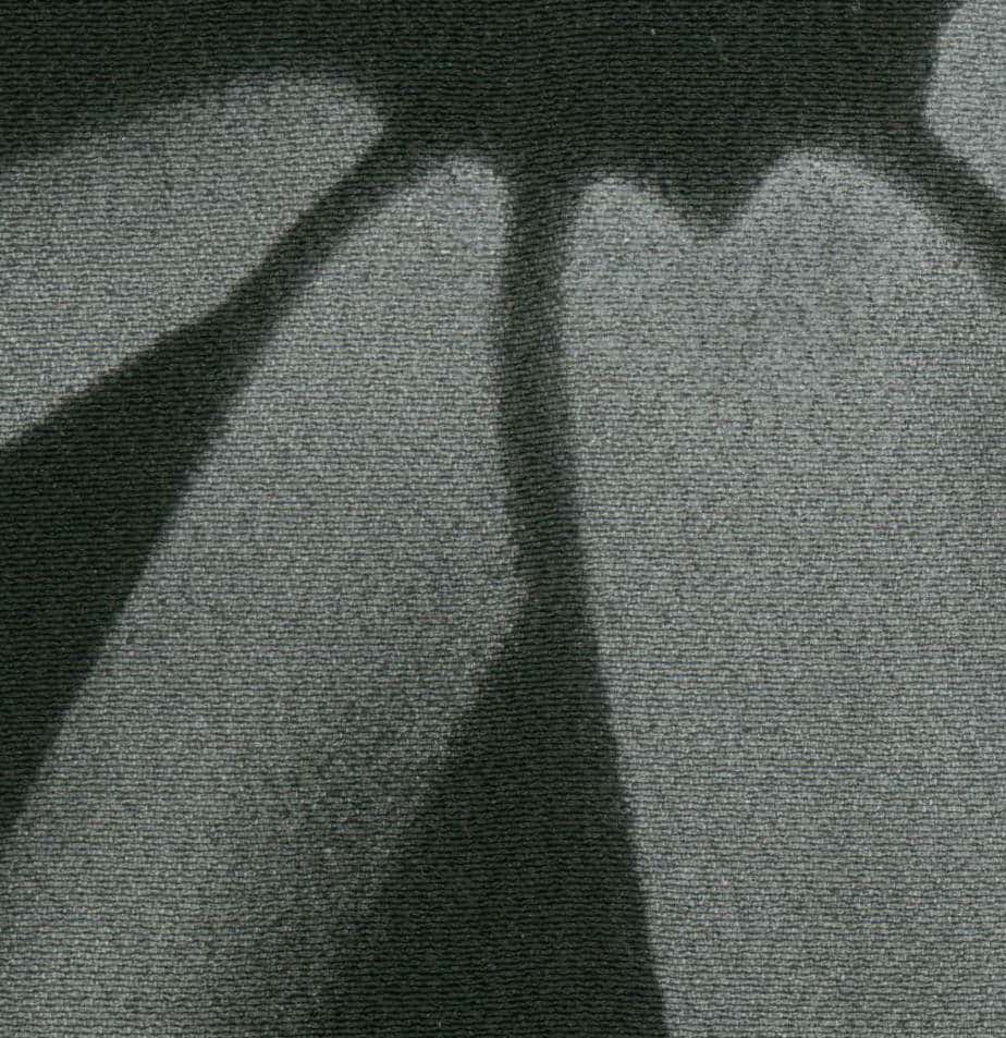 Abstract grayscale image with textured fabric and soft curved shadows