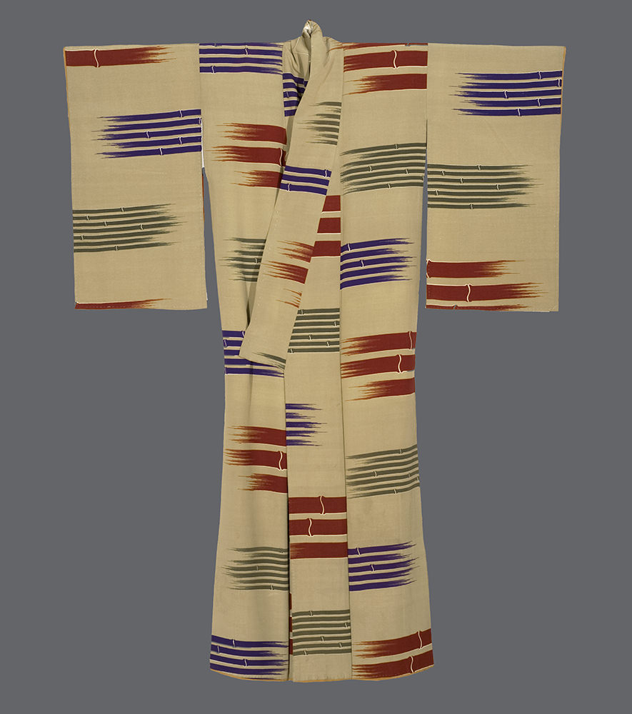 Traditional Japanese kimono with geometric blue, red, and gray ikat pattern