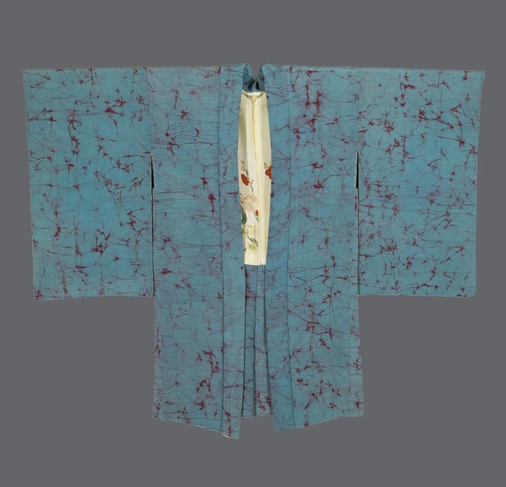 Blue-green Japanese kimono with red batik-like pattern and cream interior