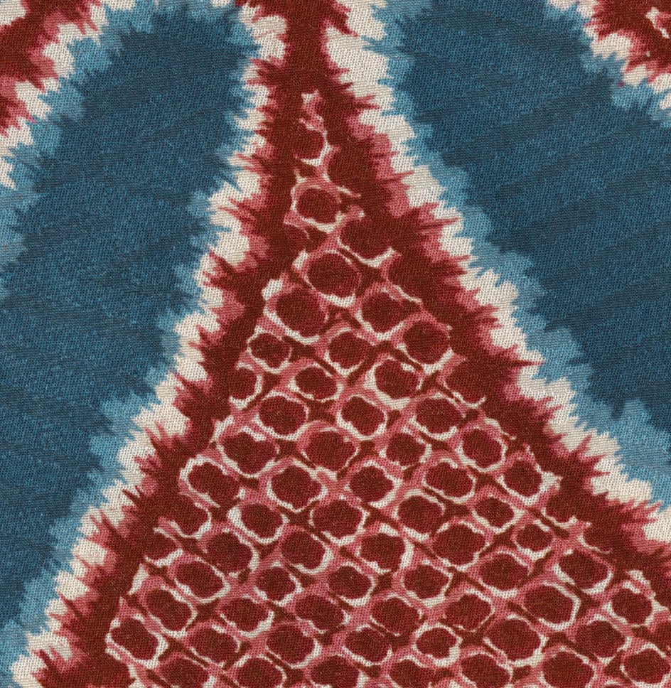 Tie-dye fabric with red and blue geometric pattern