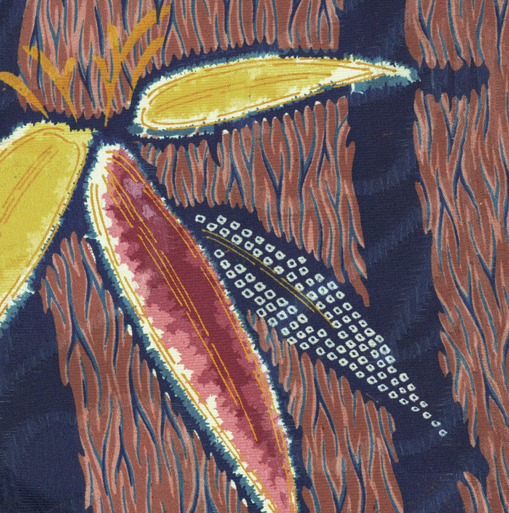 Abstract floral textile with yellow, pink, and blue stylized petals