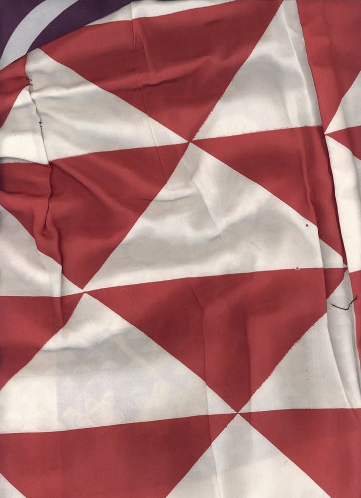 Wrinkled red and white geometric triangular pattern fabric