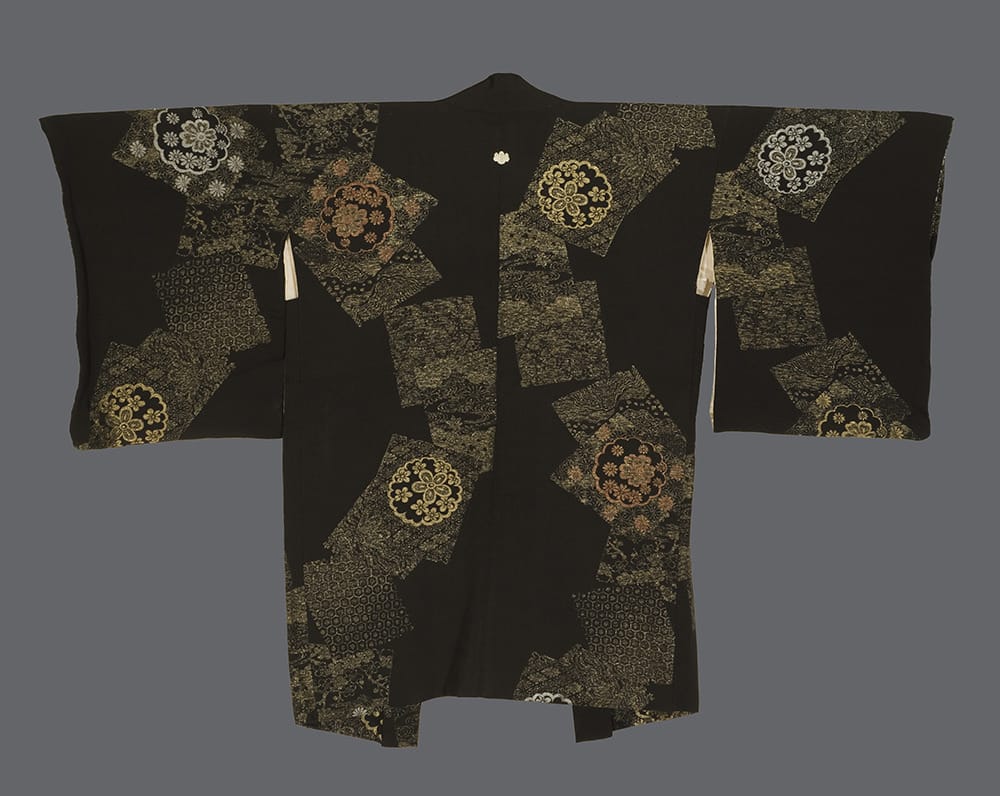 Elegant black Japanese kimono with intricate golden floral patterns