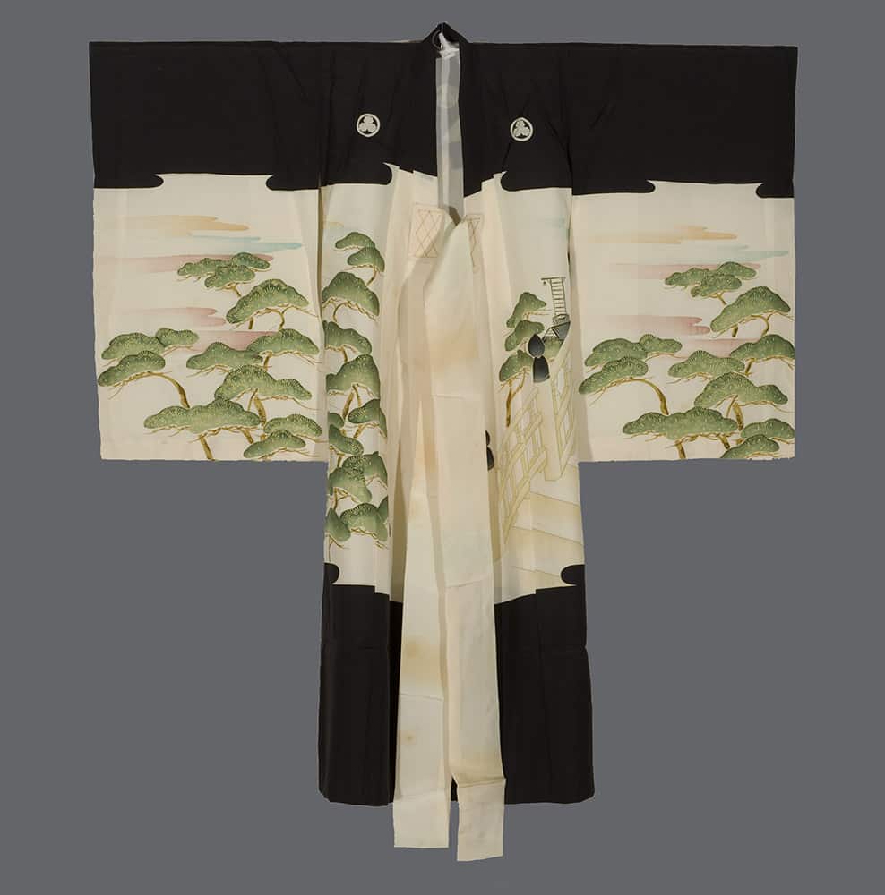 Traditional black and white Japanese kimono with green pine tree design